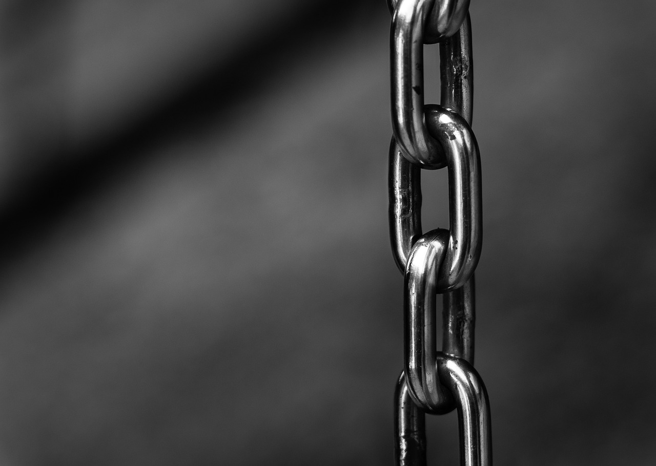 a black and white photo of a chain, modernism, depth map, side view close up of a gaunt, mid shot photo