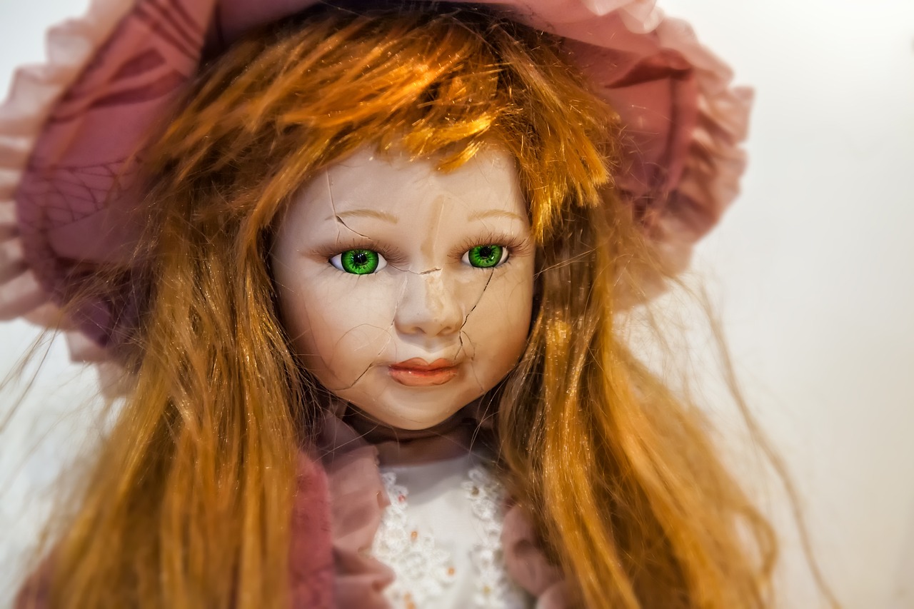 a close up of a doll with green eyes, inspired by Margaret Brundage, renaissance, sullen old maid ( redhead, high detailed photo, detailed picture, ghost of a young girl