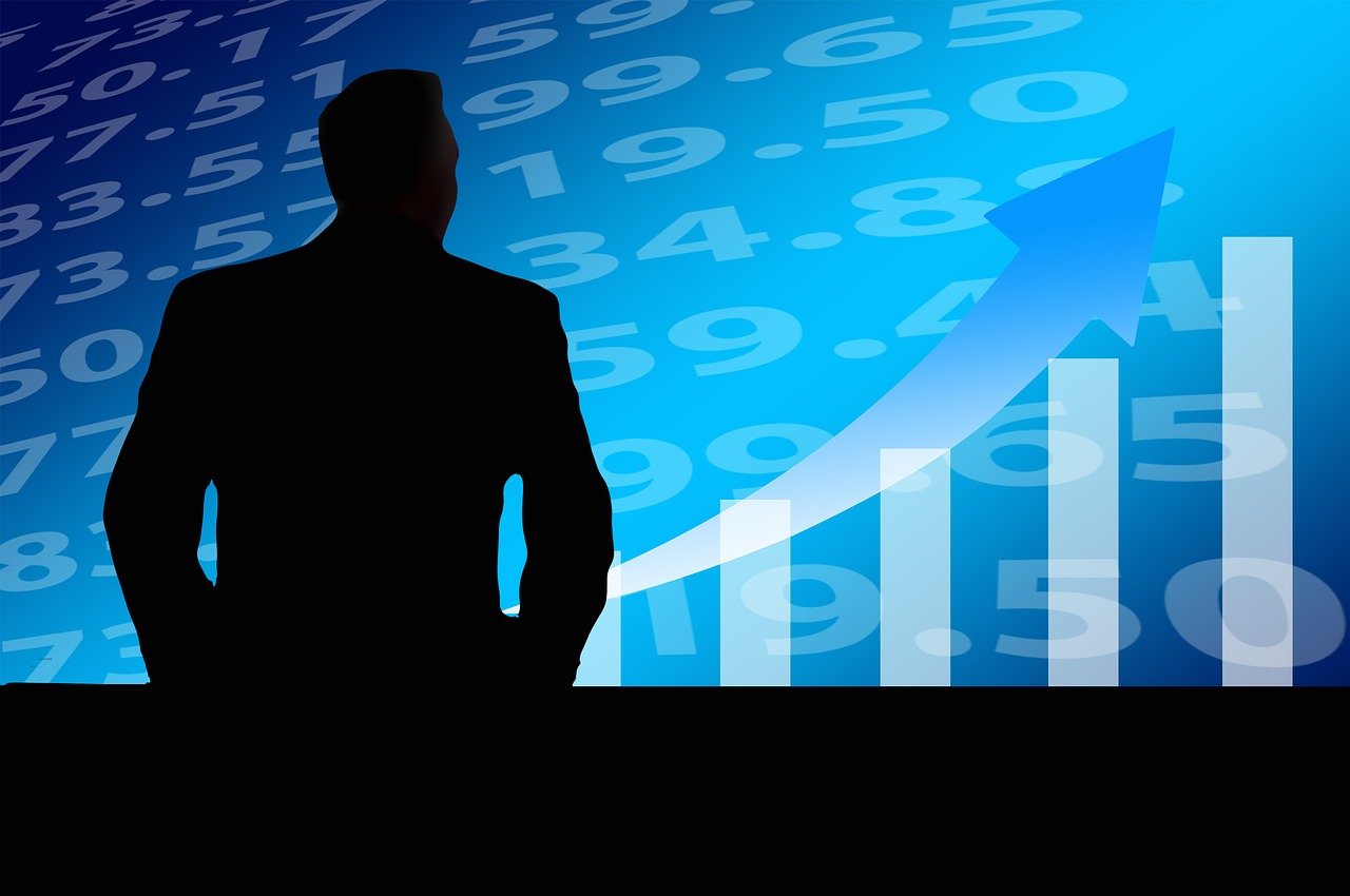 a silhouette of a man standing in front of a chart, a photo, by Ingrida Kadaka, trending on pixabay, digital art, with a blue background, trading stocks, numerical, stock photo