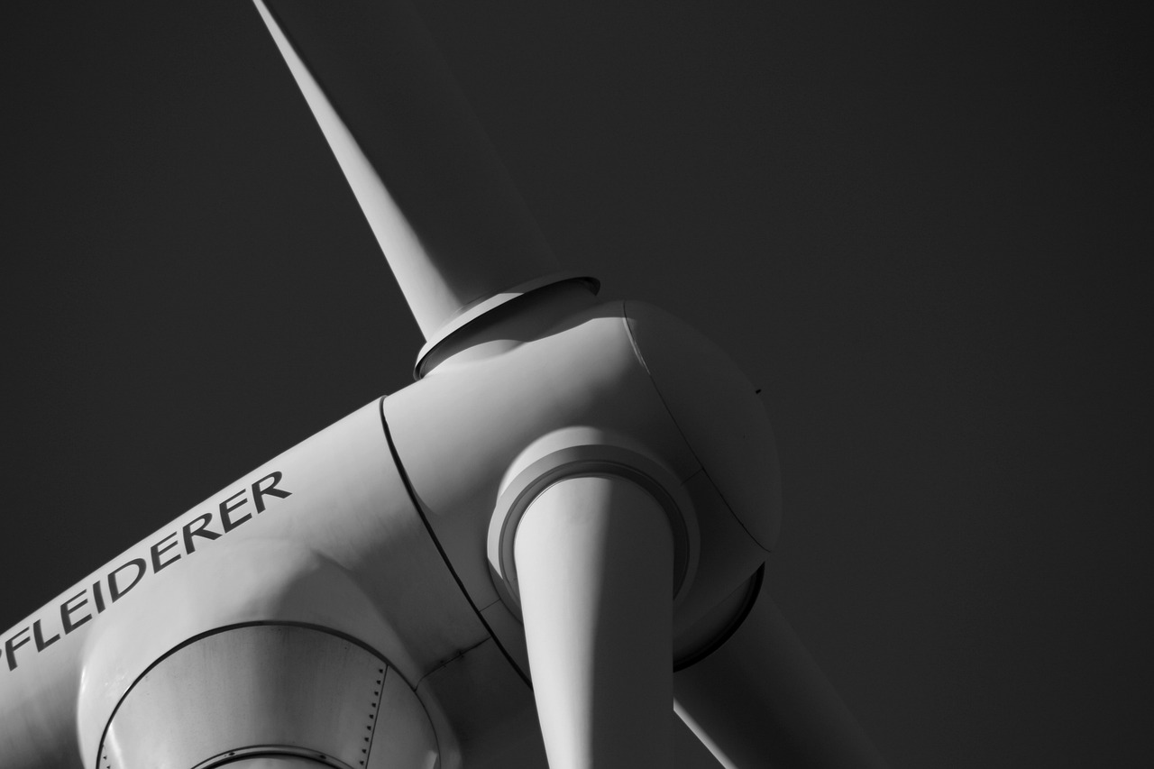 a black and white photo of a wind turbine, by Thomas Häfner, pexels contest winner, closeup 4k, laser, stock photo