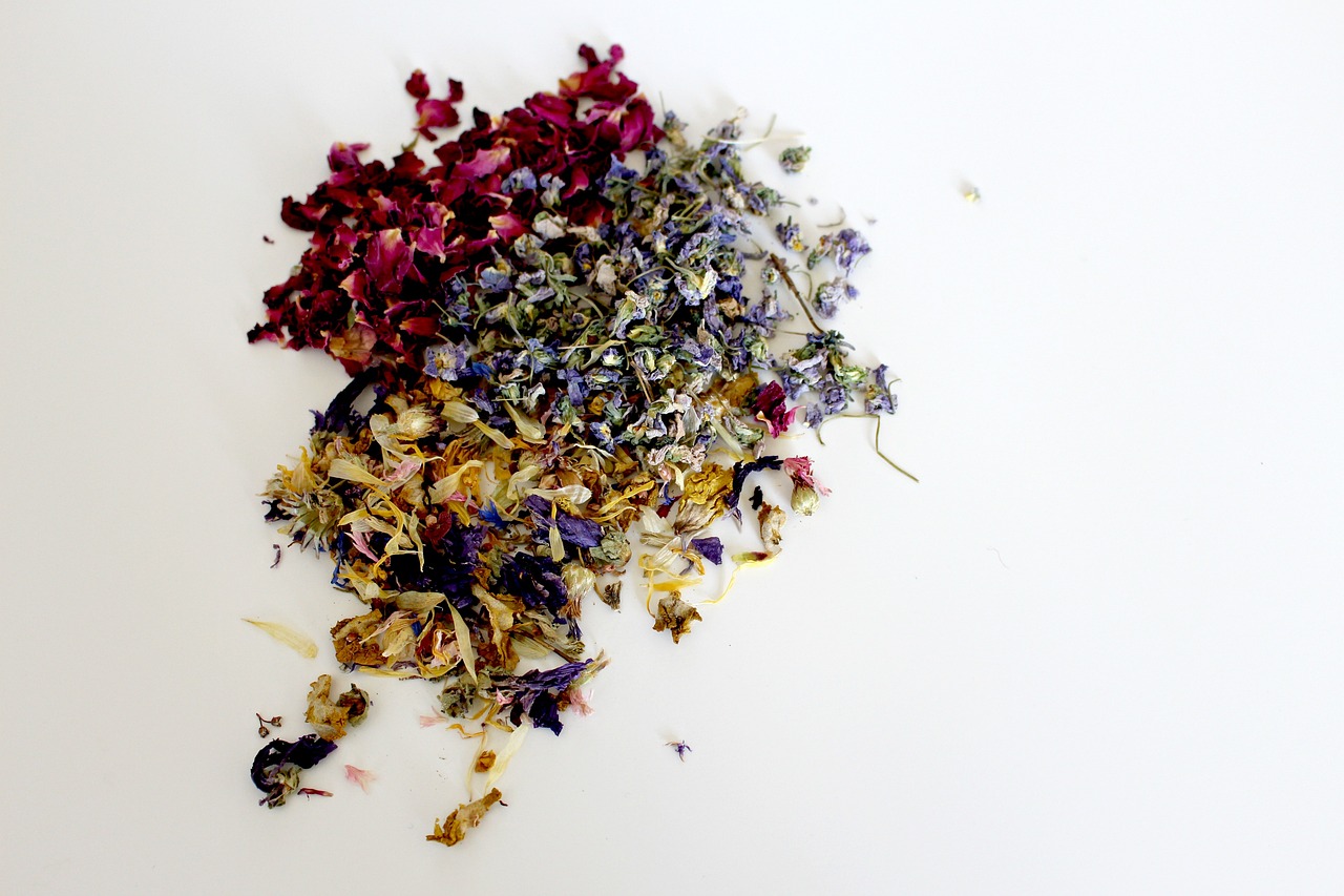 a pile of dried flowers on a white surface, process art, multi colored, tea, beth harmon, mixing