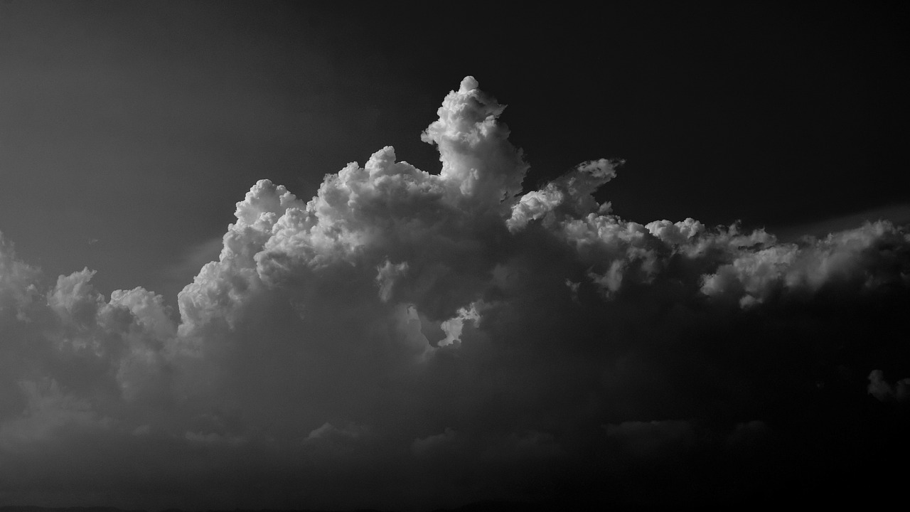 a black and white photo of a cloudy sky, unsplash, giant cumulonimbus cloud, high contrast of light and dark, hq 4k phone wallpaper, michael bair