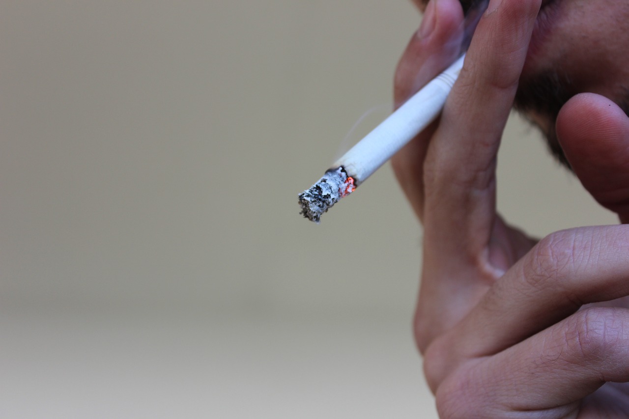 a close up of a person smoking a cigarette, a picture, by Jakob Gauermann, shutterstock, image, stock photo