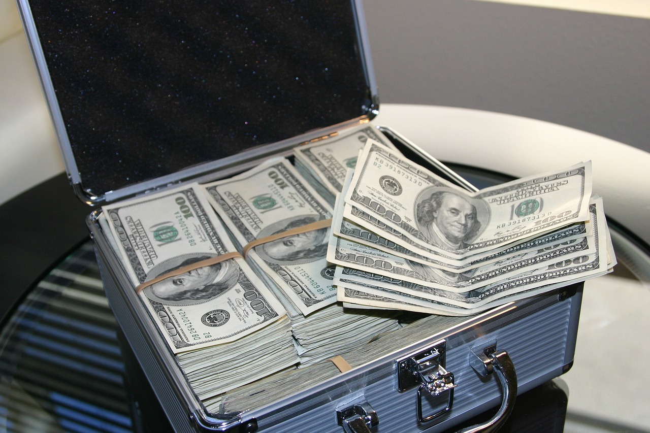a suitcase full of money sitting on top of a table, by Siona Shimshi, pixabay, holography, fbi raid, flaunting his wealth, $100000000, wsop