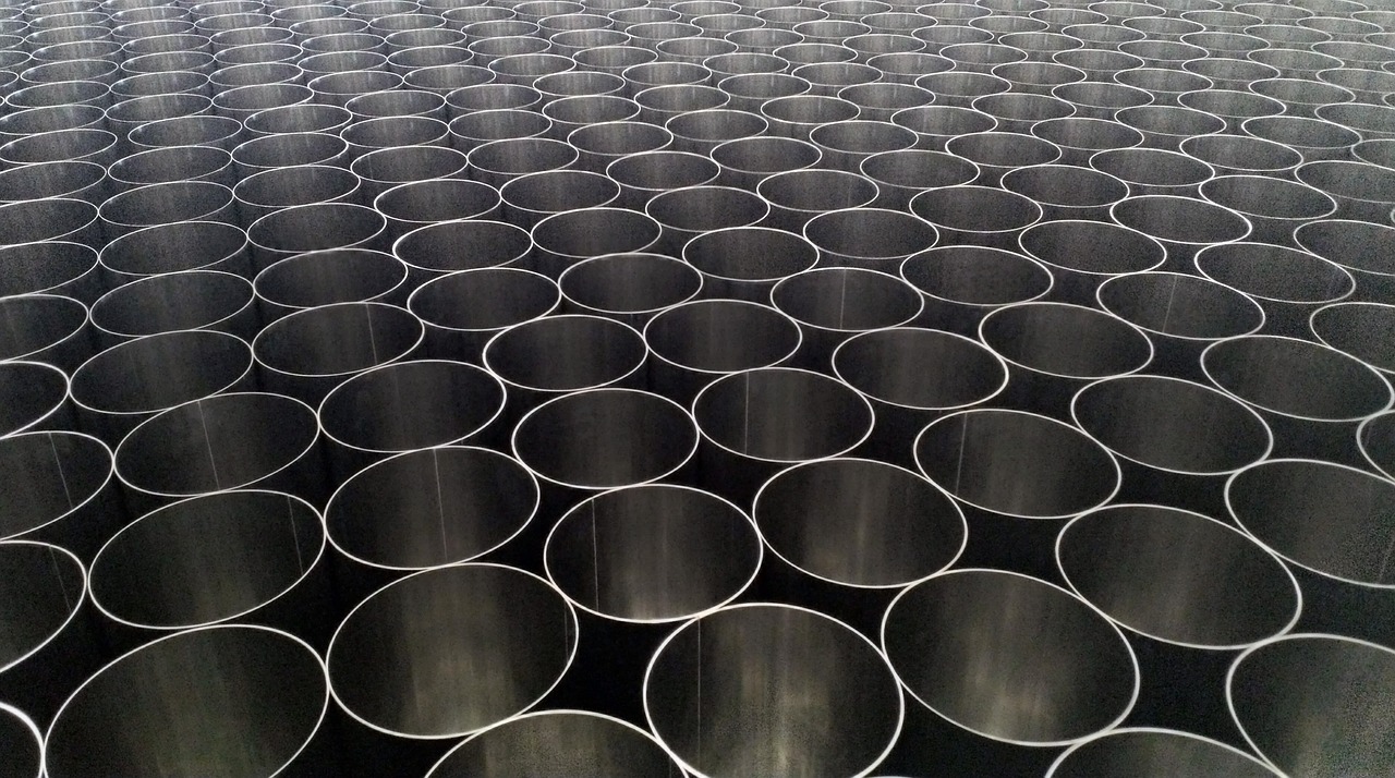 a bunch of metal pipes stacked on top of each other, by Ai Weiwei, unsplash, op art, huge black circle, beakers, 4 k close up, lined up horizontally