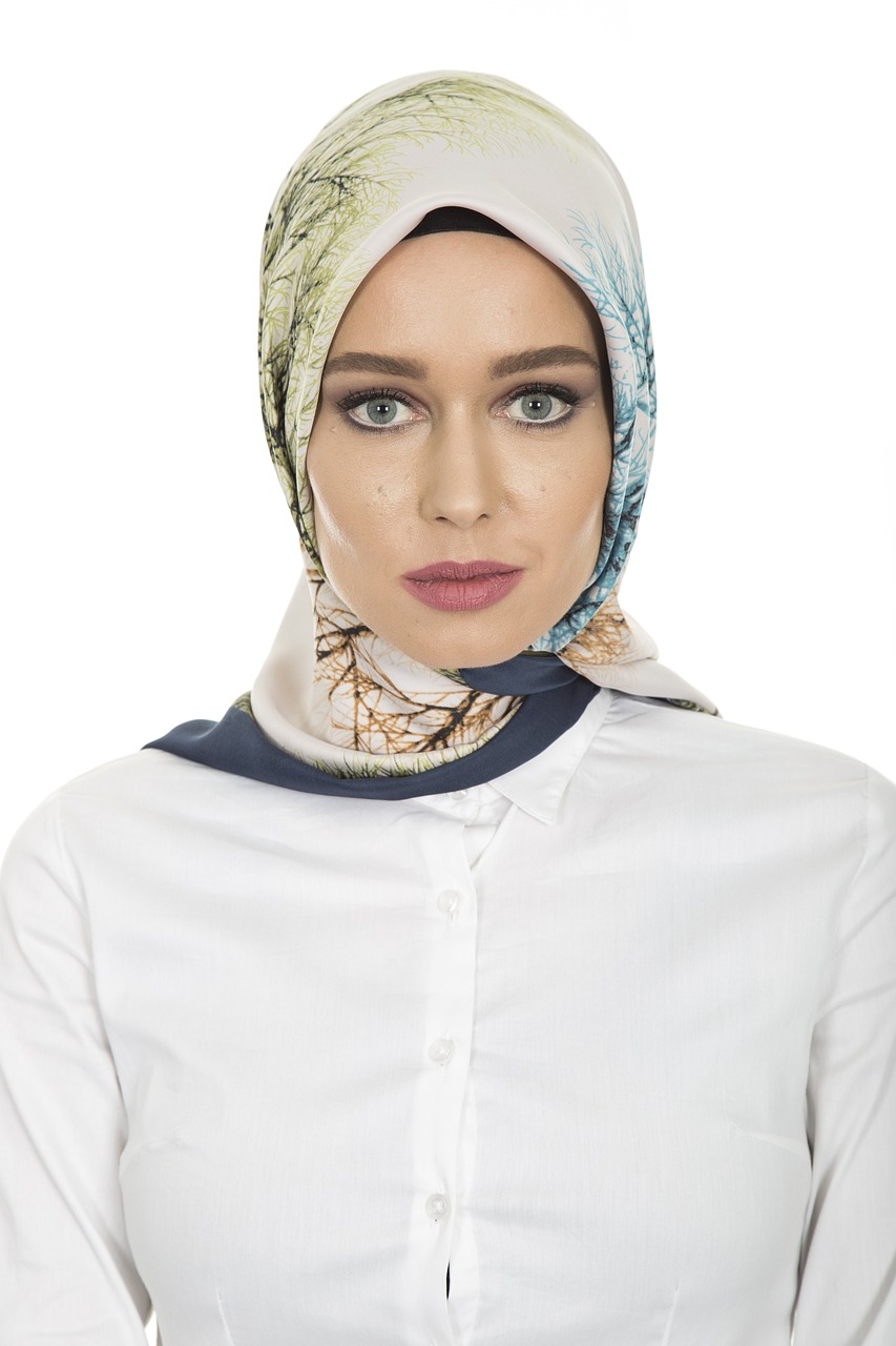 a close up of a person wearing a headscarf, a colorized photo, shutterstock, hurufiyya, high detail product photo, female in office dress, - h 8 0 4, with trees