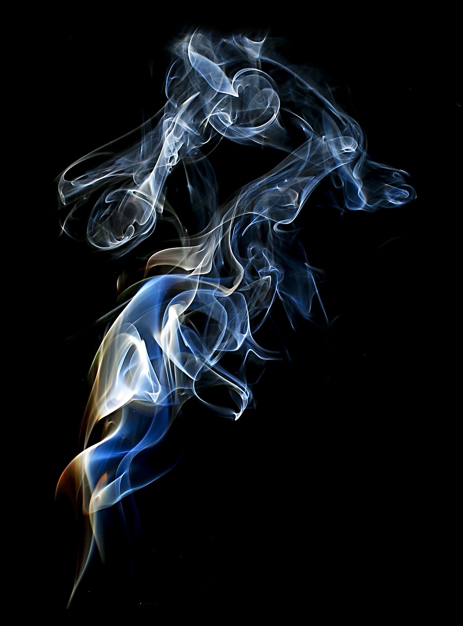 a close up of smoke on a black background, a picture, by Jan Rustem, light blues, mystical swirls, stacked image, smoking cigarettes