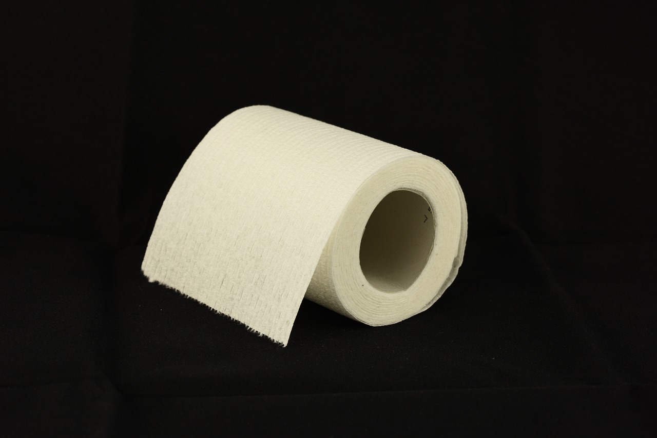 a roll of toilet paper on a black background, a picture, high res photo, 8 0 mm photo
