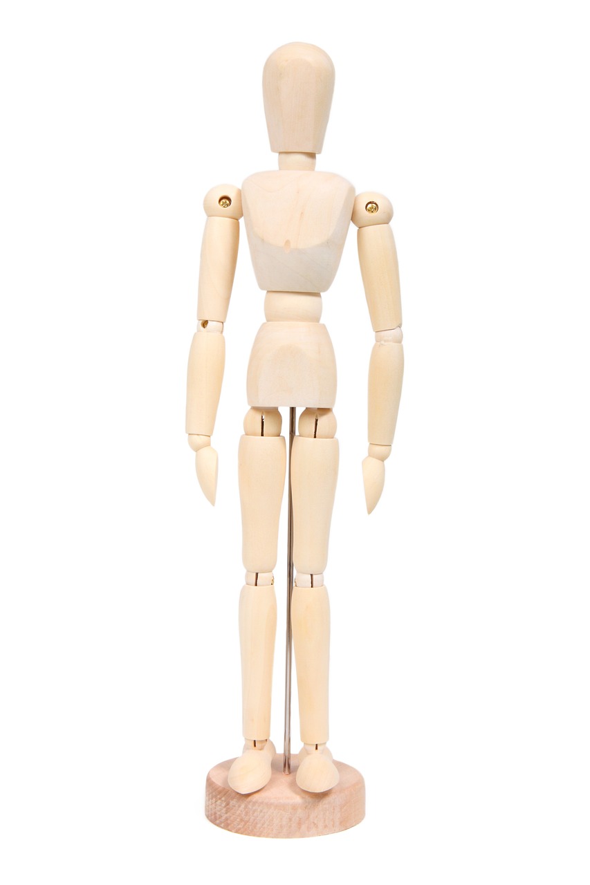 a wooden mannequin standing in front of a white background, product introduction photo