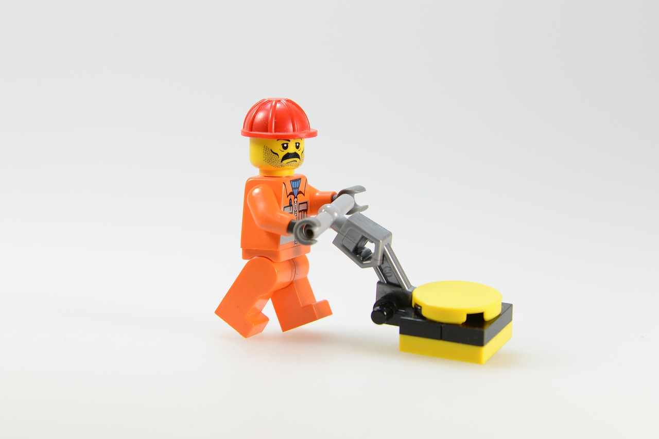 a lego man with a hammer in his hand, a stock photo, disassemble the computer, high detail product photo, orange, detailed product photo
