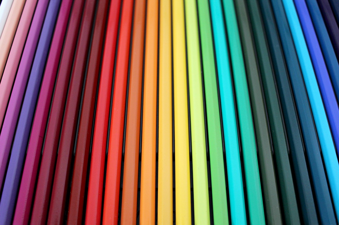 a close up of a bunch of colored pencils, by Rachel Reckitt, rainbow neon strips, brand colours are red and blue, monochrome color, matte colorful gradients