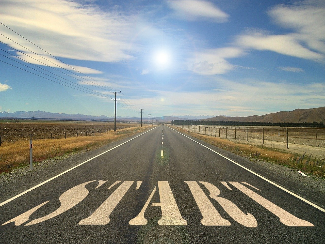 a road with a stop sign painted on it, an illustration of, shutterstock, happening, the sun is shining wide shot, start, starts, in teh style of tony start