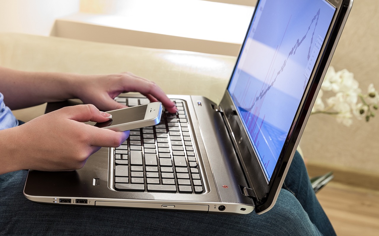 a close up of a person typing on a laptop, a photo, by Robert Medley, shutterstock, cell phone photo, full body shot, finger, saying