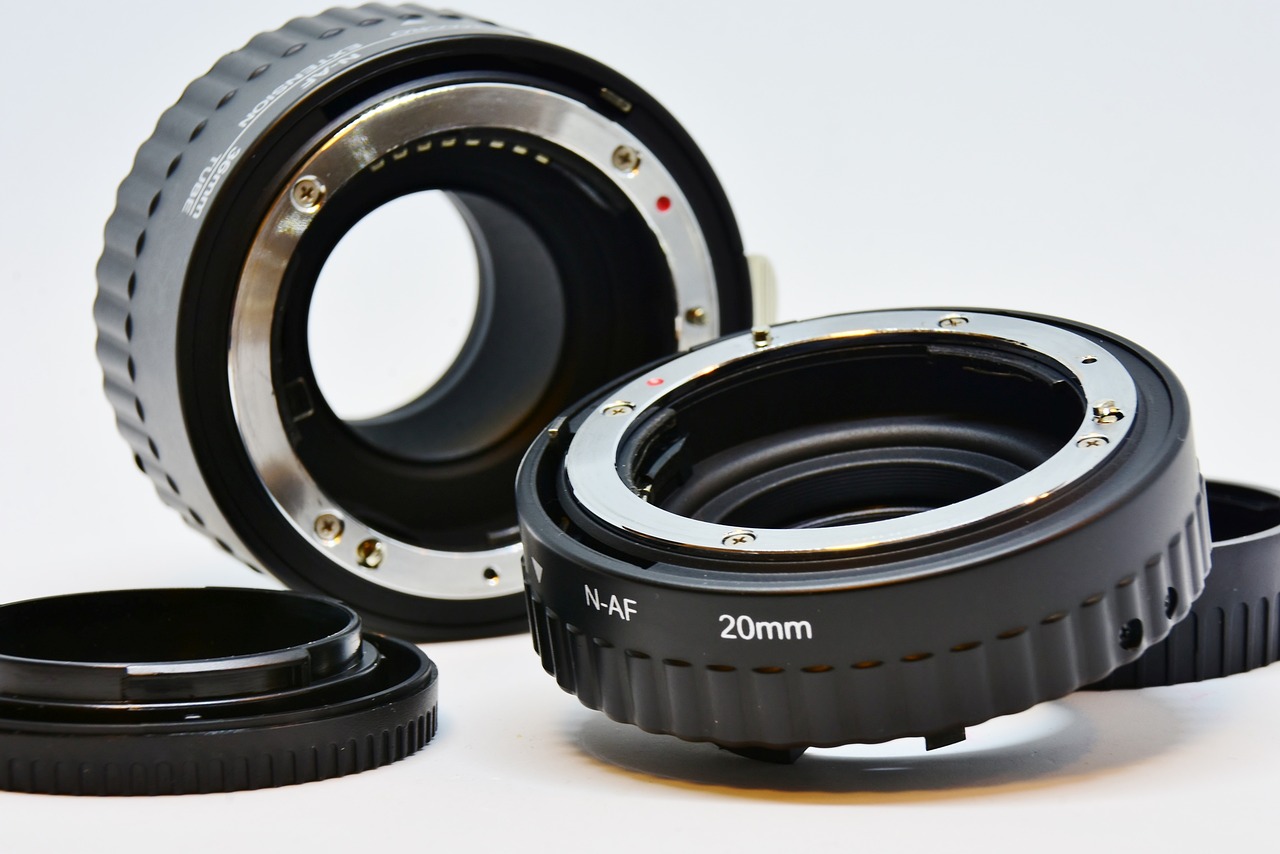 a couple of camera lenses sitting next to each other, a macro photograph, dau-al-set, exposed inner gears, modern high sharpness photo