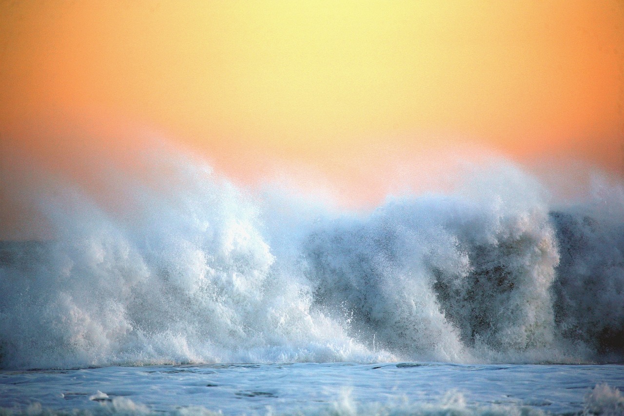 a man riding a wave on top of a surfboard, by Jan Rustem, pexels, romanticism, (light orange mist), painting of splashing water, pastel colored sunrise, fierce huge waves