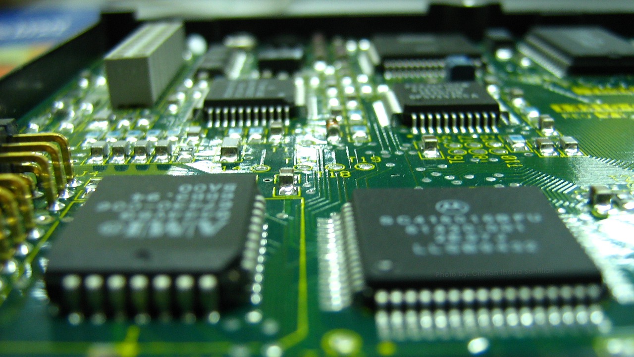a close up of a computer mother board, by Dan Christensen, flickr, renaissance, green technology, bangalore, high-tech devices, dcim