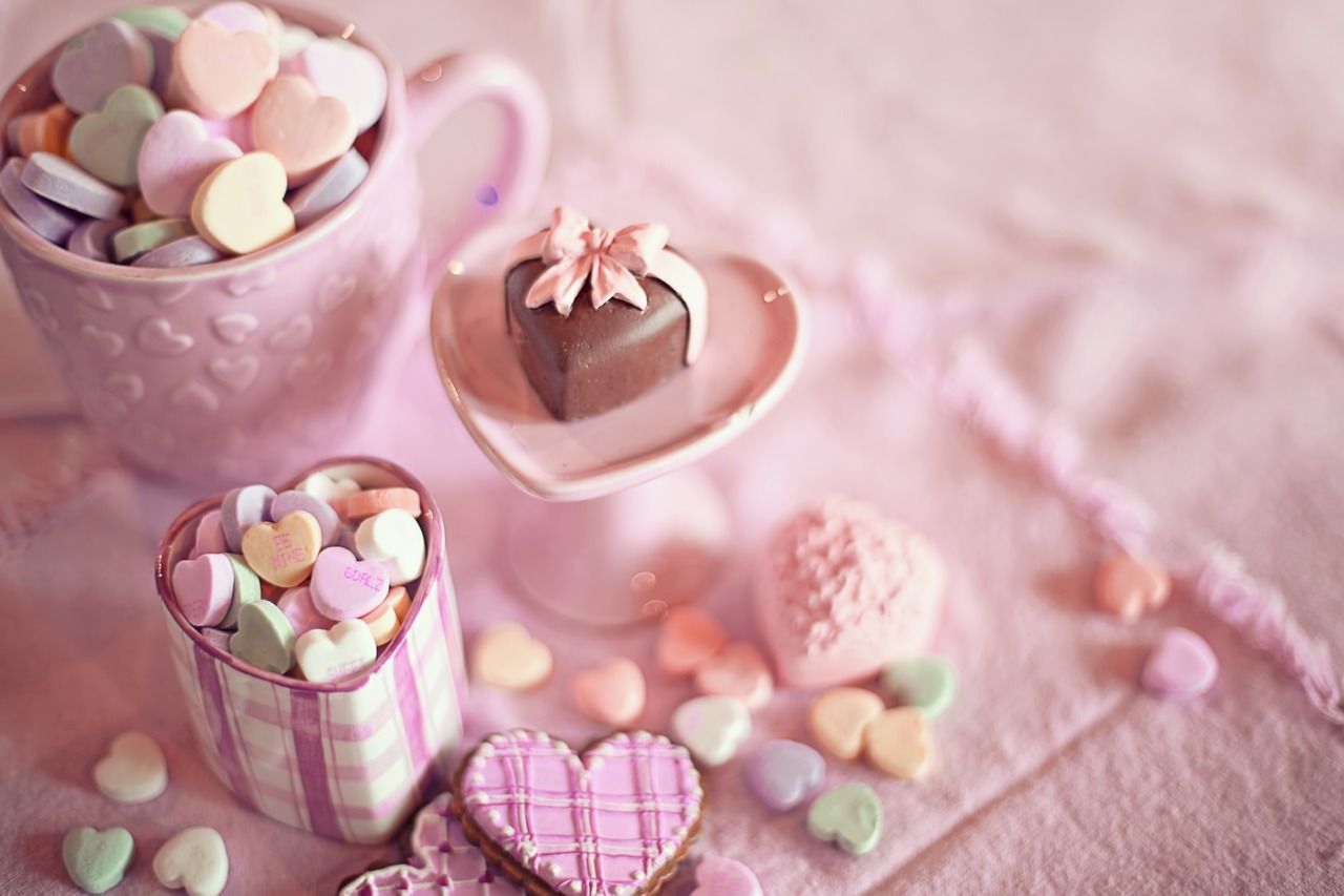 a couple of cups sitting on top of a table, a pastel, tumblr, romanticism, candies, set photo