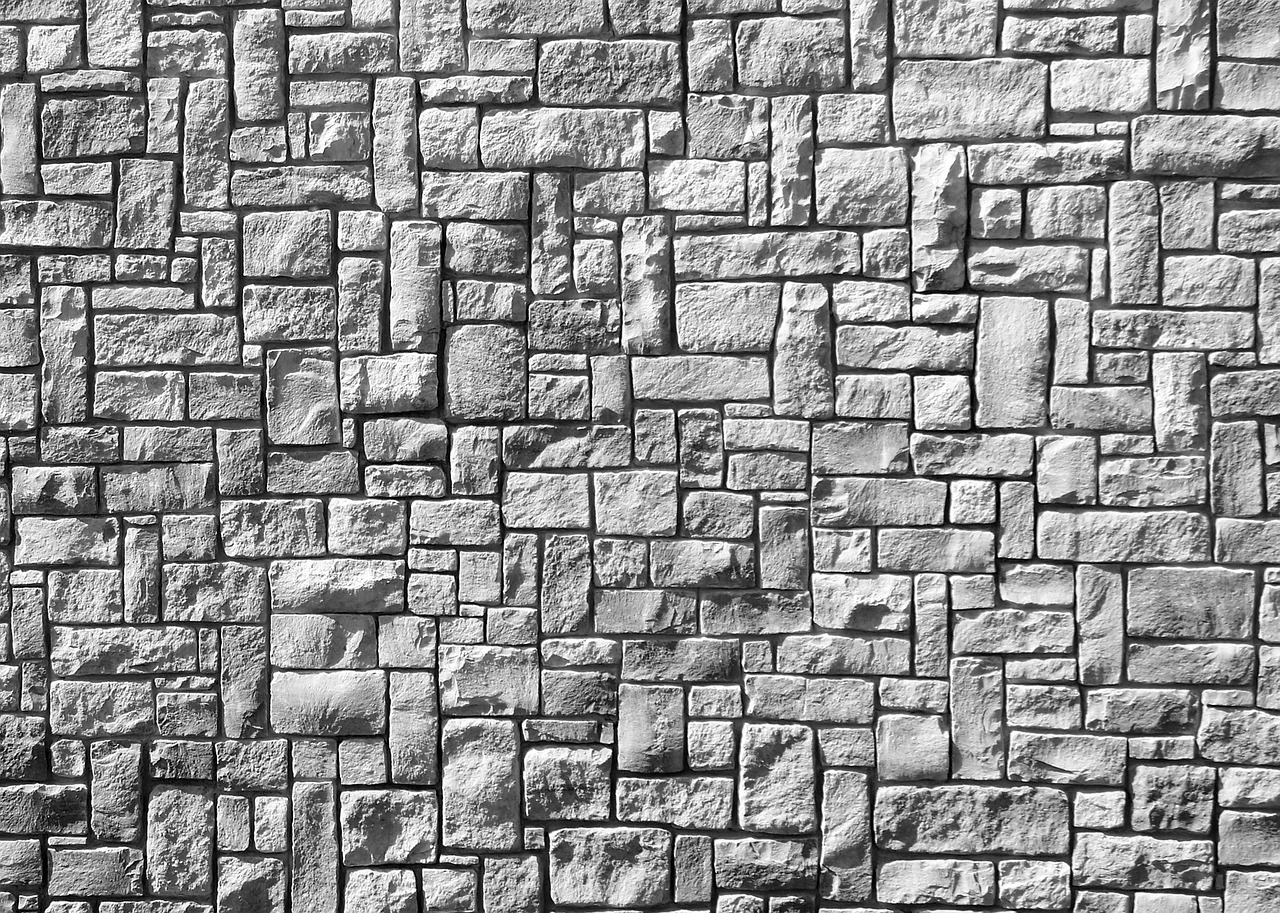 a black and white photo of a brick wall, an ambient occlusion render, by Arthur Sarkissian, stylized stone cladding texture, modern high sharpness photo, bright white castle stones, gray stone wall