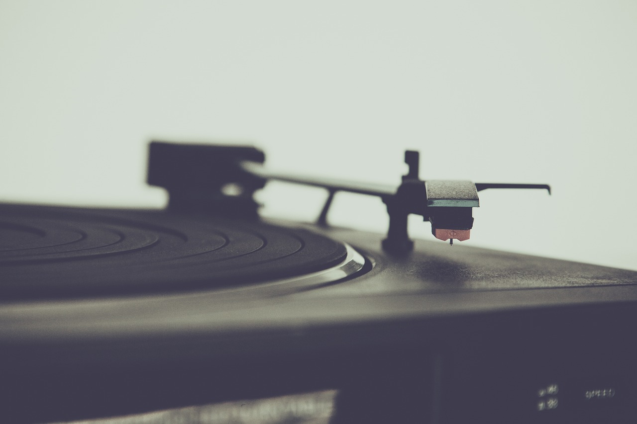 a black and white photo of a turntable, an album cover, pexels, vintage color, subtle depth of field, stock photo, tilt-shifted