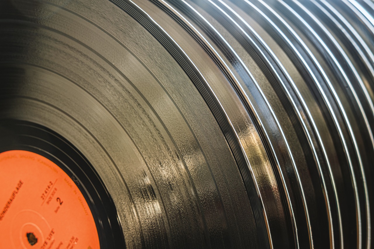 a close up of a record on a table, an album cover, by Jakob Gauermann, shutterstock, macro up view metallic, thick lines highly detailed, stock photo