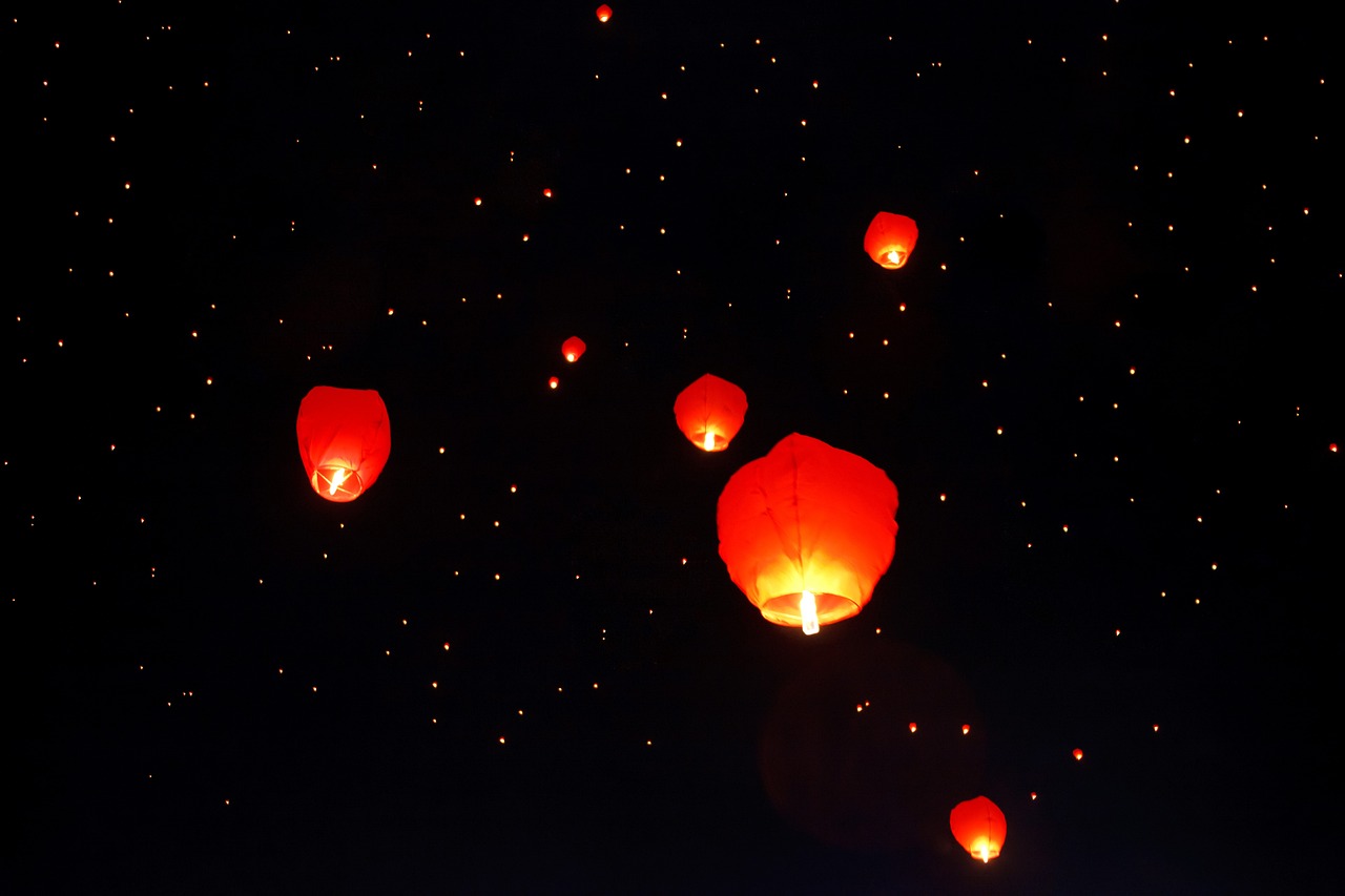 a sky filled with lots of red paper lanterns, a picture, pexels, light and space, floating among stars, with a black background, bright glowing instruments, dsrl photo