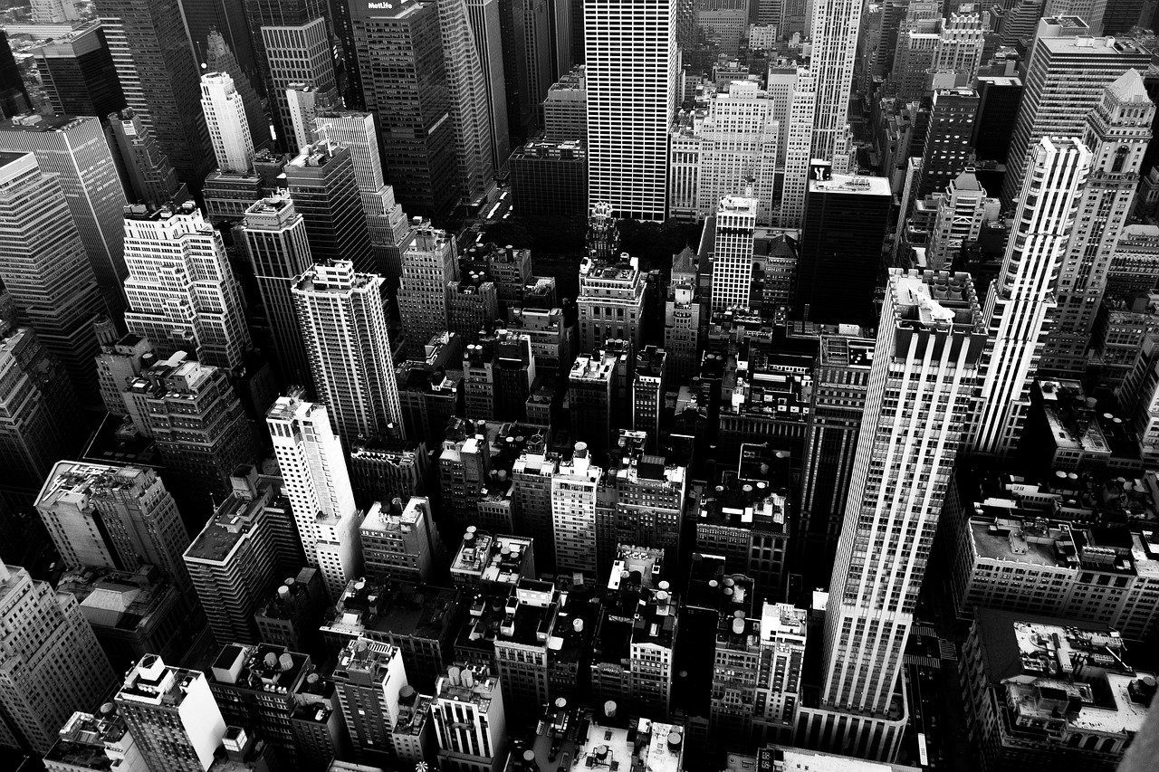 a black and white photo of a city, inspired by Thomas Struth, pexels, cramped new york apartment, wide high angle view, black an white, view from high