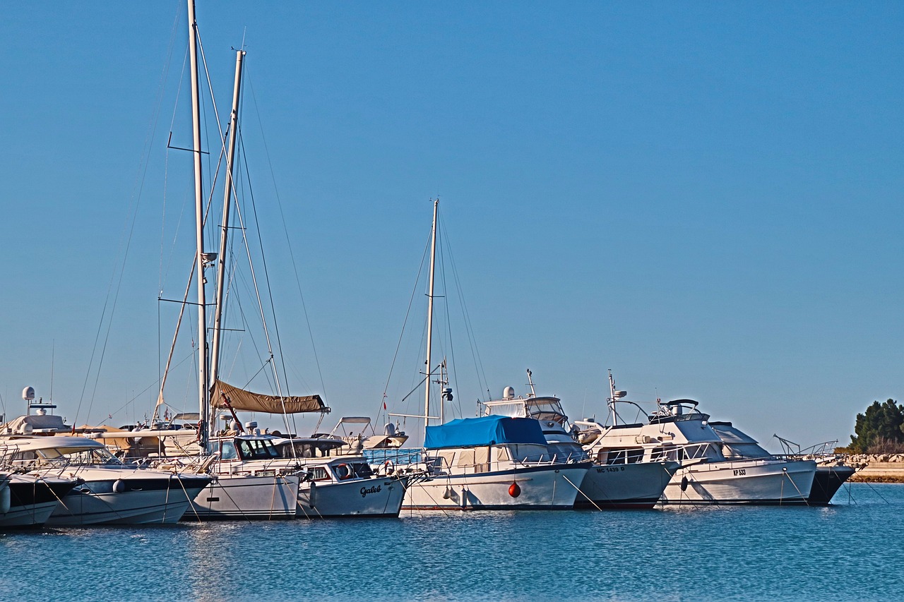 a number of boats in a body of water, a photo, by Charles Billich, shutterstock, fine art, marbella, slightly sunny weather, bored ape yacht club, 3 / 4 extra - wide shot