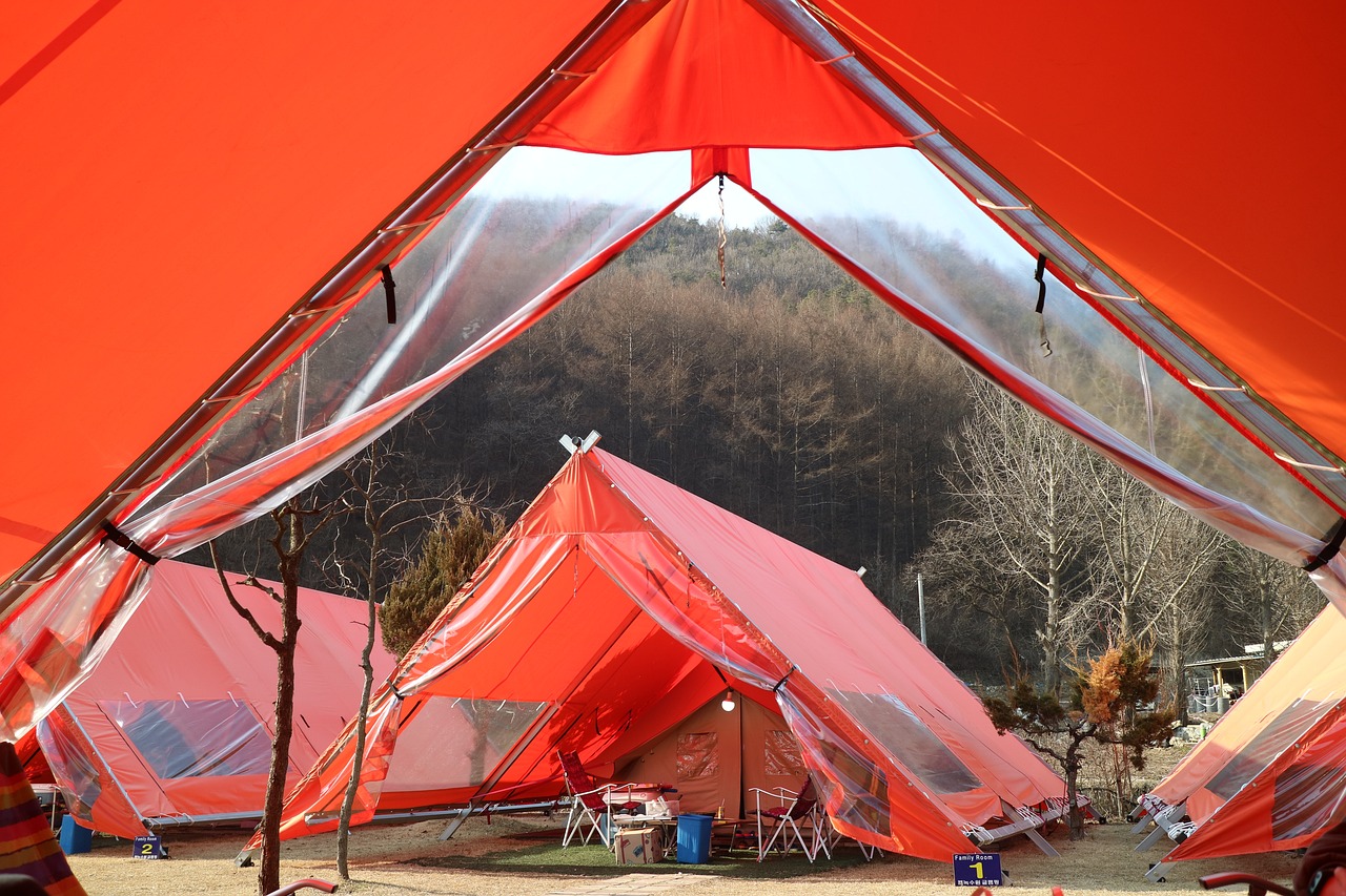 a group of tents sitting next to each other, temporary art, hong soonsang, orange ray, view from bottom, closeup photo