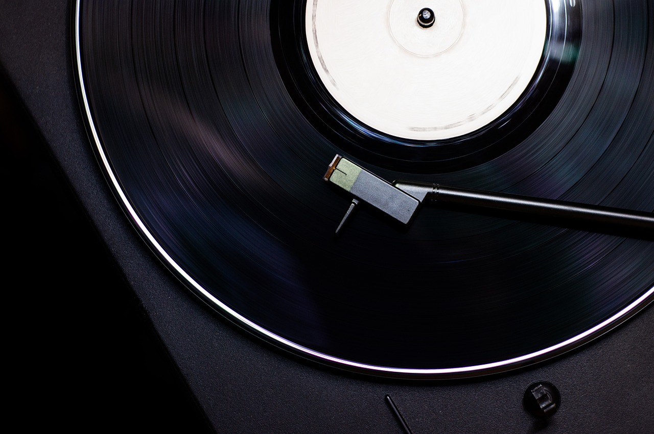 a close up of a record on a turntable, an album cover, by Hariton Pushwagner, unsplash, istock, very sharp photo, 1 9 8 0 s photo, time dragging on for too long