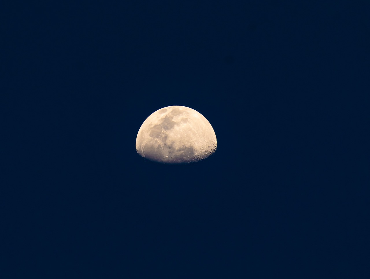 the moon is lit up in the dark blue sky, a picture, by Jan Rustem, minimalism, 8k 50mm iso 10, telephoto, noon, half body photo