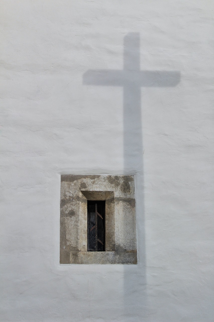 a shadow of a cross on the side of a building, white walls, in an ancient altar, the window, 3 4 5 3 1