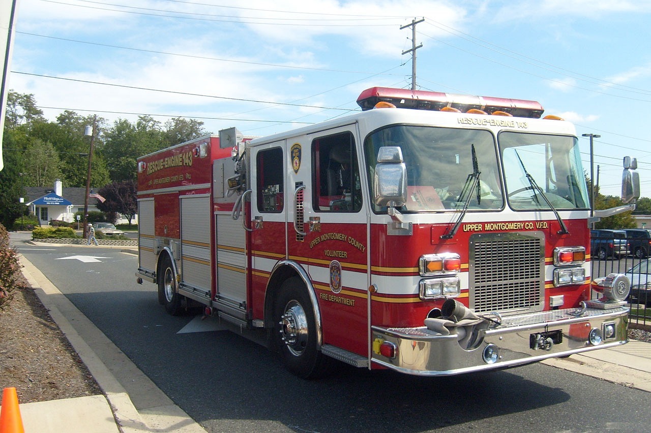 a fire truck parked on the side of the road, a photo, by Nancy Spero, dsrl photo, light lighting side view, full device, side front view