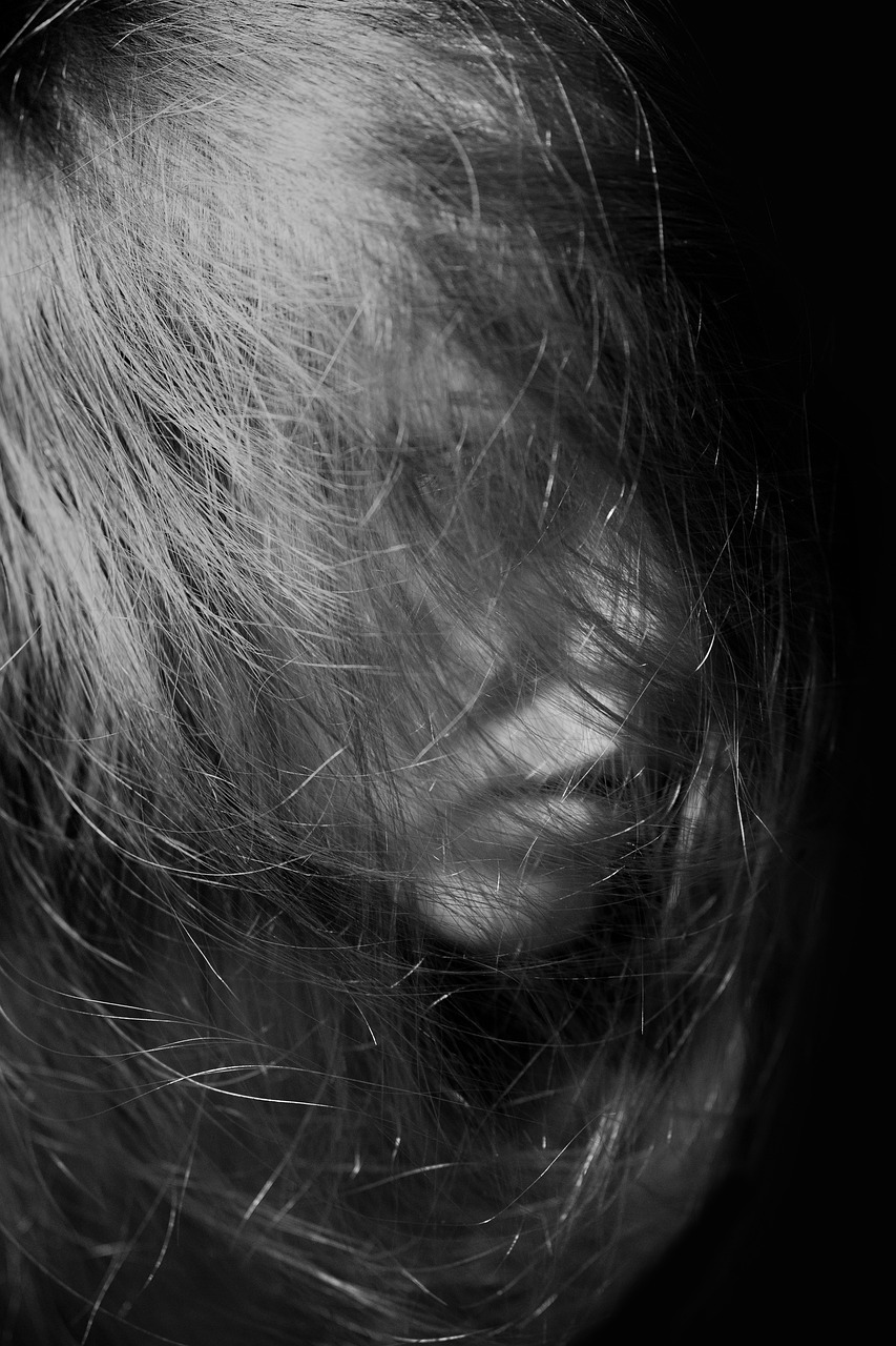 a black and white photo of a woman's hair, inspired by Katia Chausheva, hurufiyya, exhausted face close up, hiding, 4k greyscale hd photography, stable diffusion self portrait