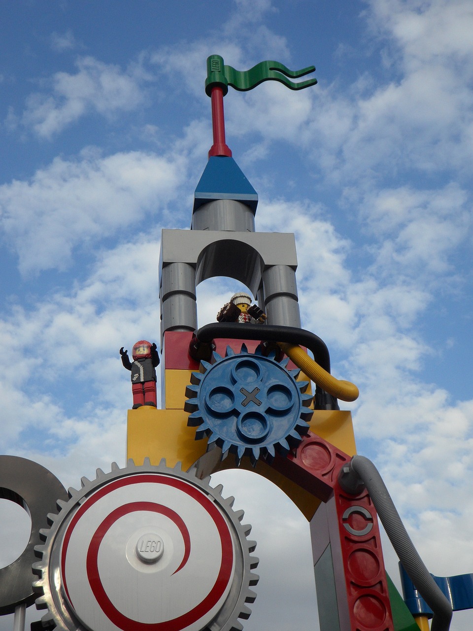 a clock tower with a clock on top of it, inspired by Rube Goldberg, flickr, lego character, digger land amusement park, harajuku, closeup - view