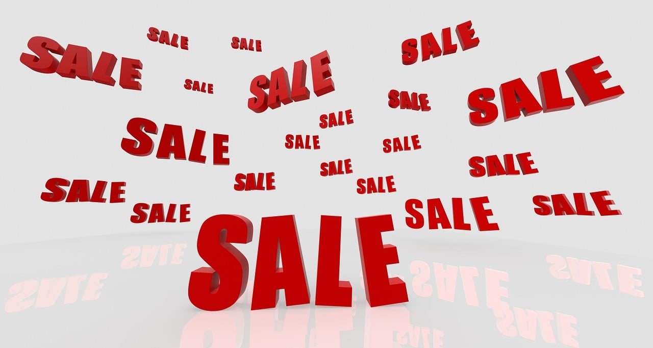 a red sale sign sitting on top of a white surface, a stock photo, by Samuel Scott, shutterstock, digital art, flying, hundreds of them, on a pale background, ebay photo