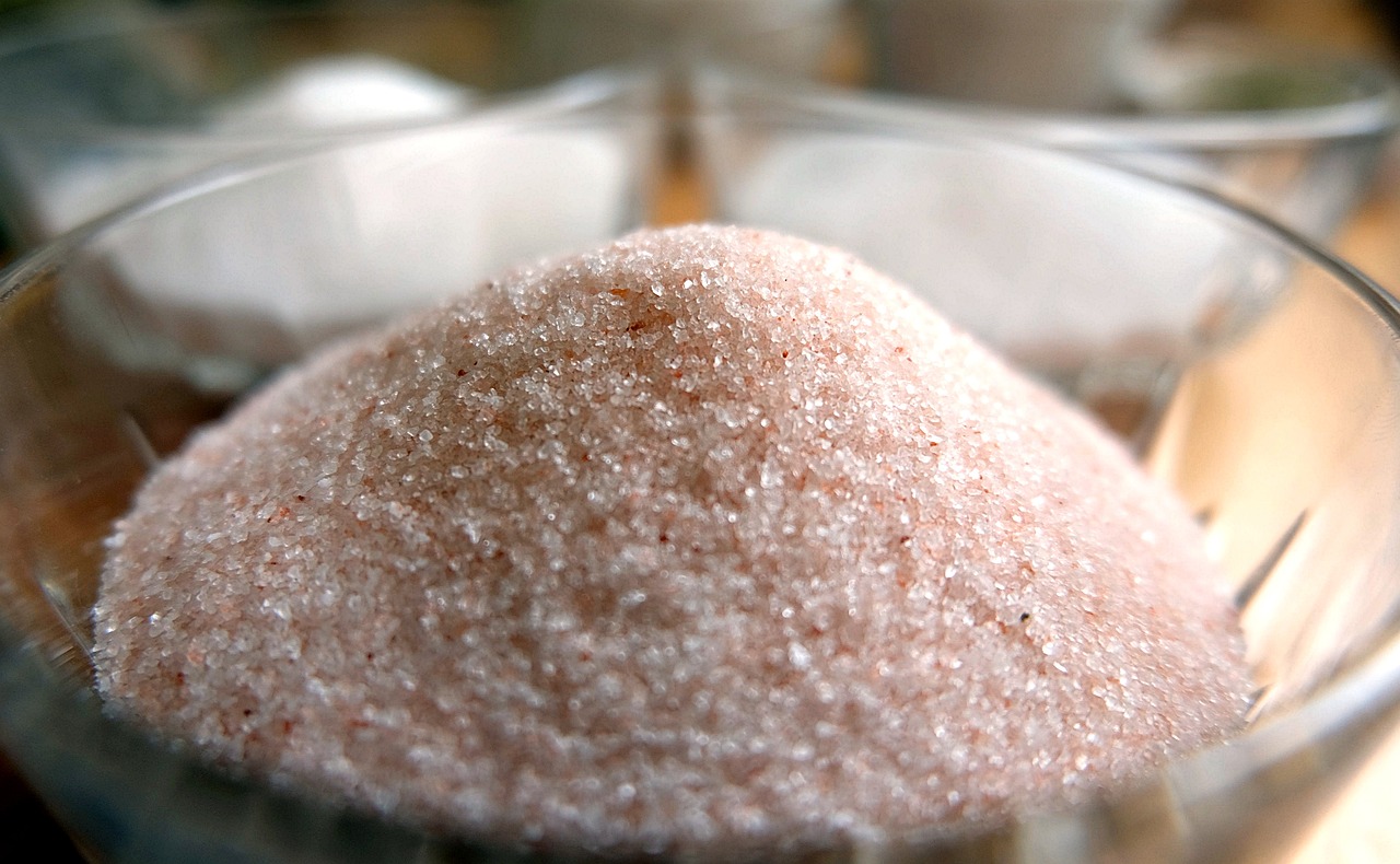 a bowl of sugar sitting on top of a wooden table, inspired by Samuel Silva, flickr, macro detail, blush, glistening body, slush))