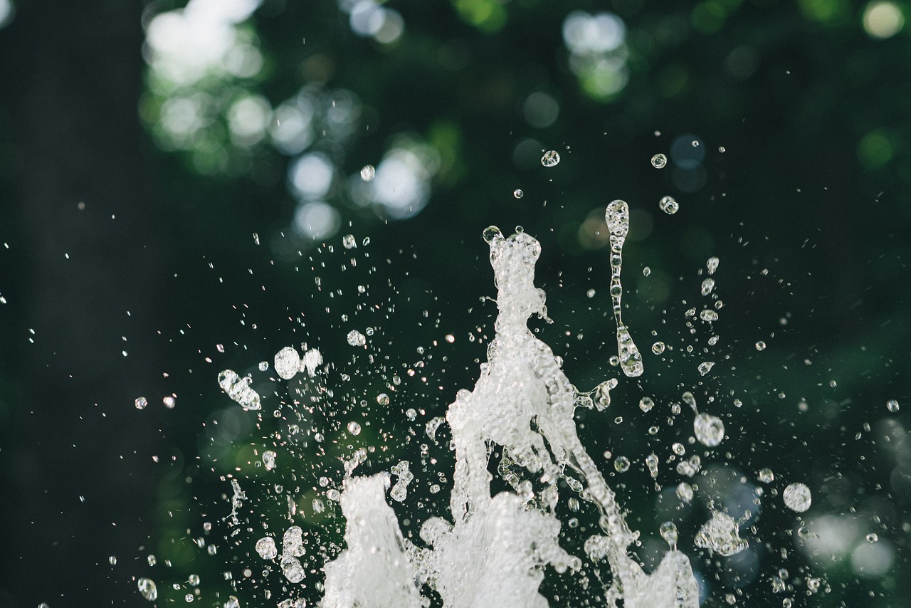 a fire hydrant spewing water into the air, by Cherryl Fountain, unsplash, process art, big drops of sweat, waterfall background, baptism, high details photo