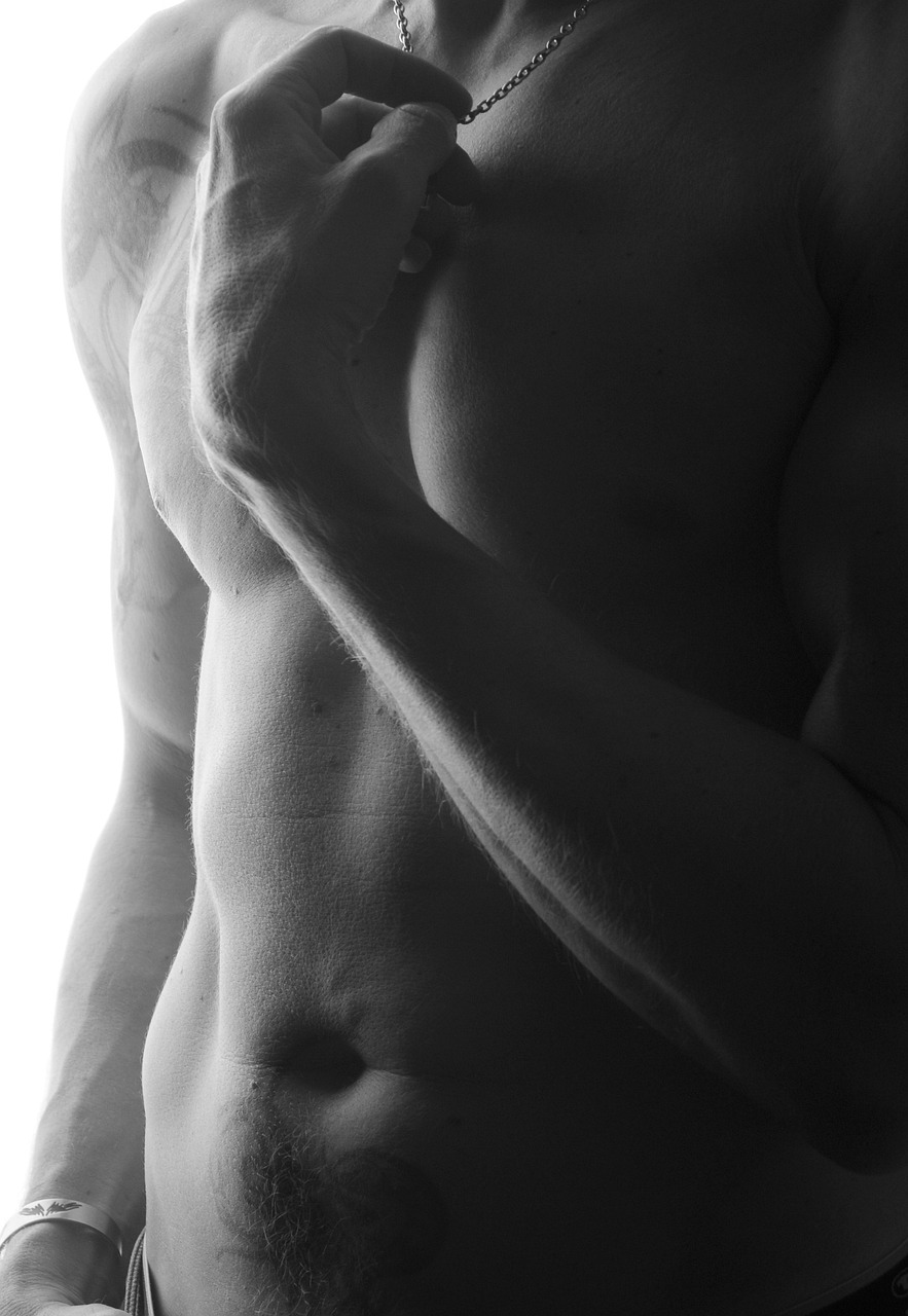 a black and white photo of a shirtless man, a photo, inspired by Robert Mapplethorpe, minimalism, close - up studio photo, sensual bodies, rendered image, high details photo
