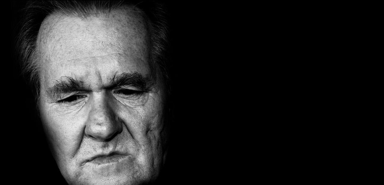 a black and white photo of a man's face, inspired by Yousuf Karsh, pexels, minimalism, color photo of josip broz tito, kurt russell, portrait. 8 k high definition, wallpaper - 1 0 2 4