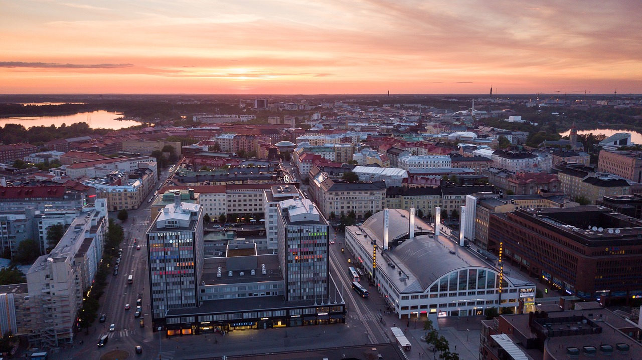 an aerial view of a city at sunset, by Samu Börtsök, happening, entertainment district, wide long view, high res photo