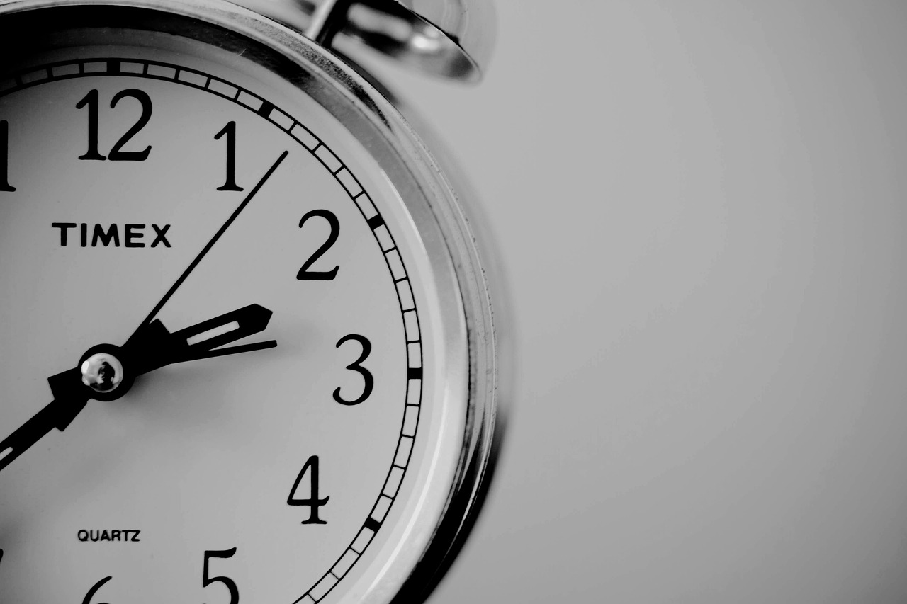 a black and white photo of a clock, a photo, by Andrei Kolkoutine, pexels, basic background, good morning, folding - time, countdown