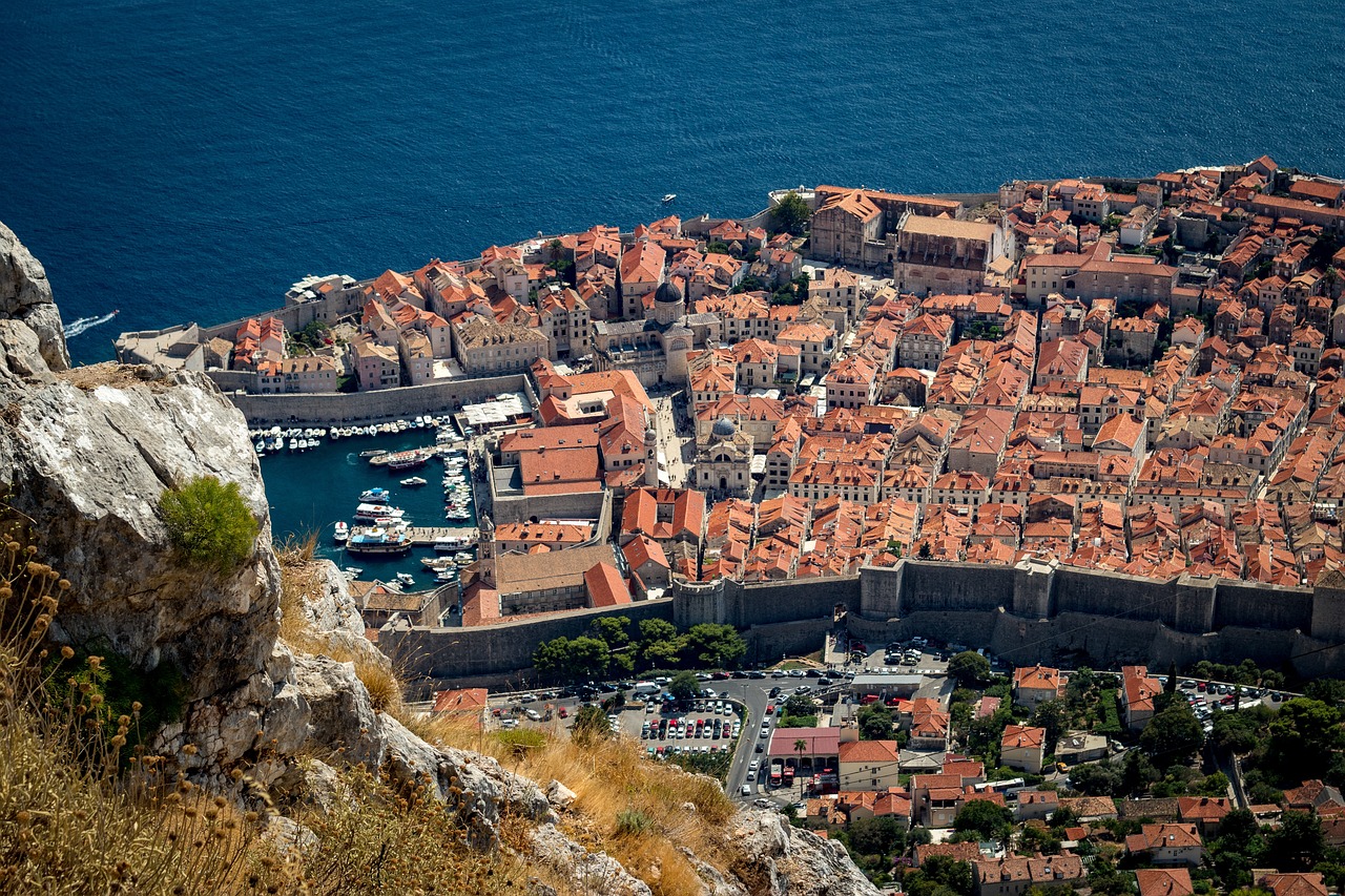 an aerial view of the city of dubna, croatia, pexels, happening, dubrovnik, ocean view, orange roof, view from the side”