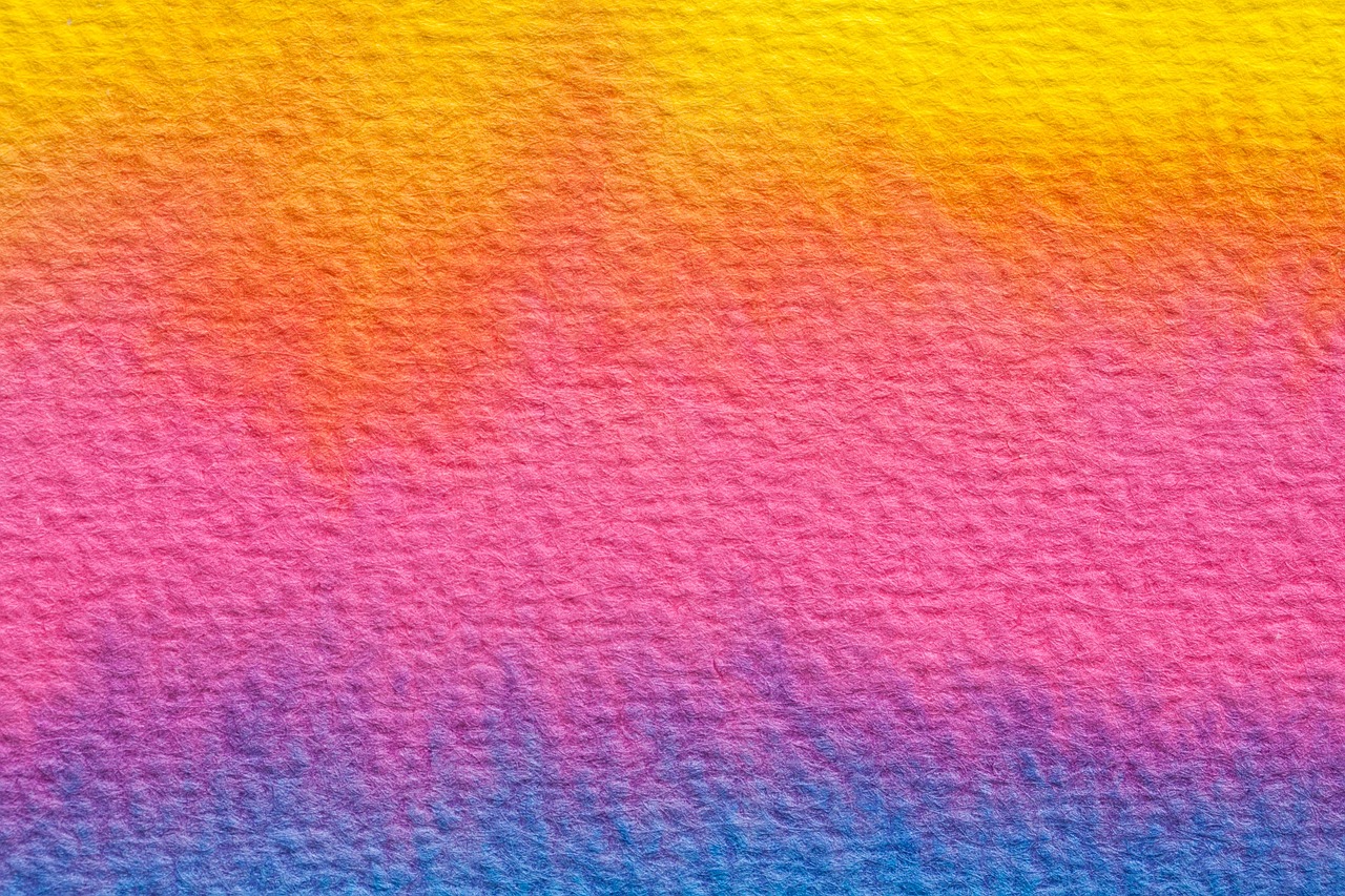 a close up of a rainbow colored background, a watercolor painting, inspired by Maler Müller, shutterstock, color field, vibrant sunset, grained risograph, 1128x191 resolution, handcrafted paper background