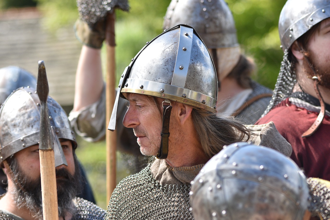 a group of men in armor standing next to each other, a portrait, by Dave Allsop, pixabay, hurufiyya, wearing a helmet, norwegian man, closeup - view, preparing to fight