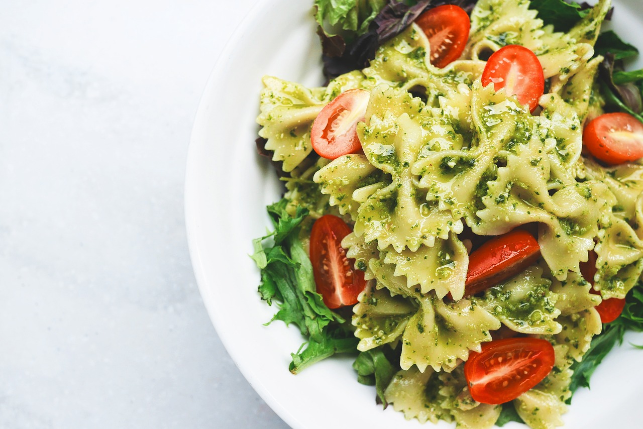 a bowl of pasta with tomatoes and lettuce, a picture, inspired by Lucia Peka, pexels, bowknot, pastel green, 🦩🪐🐞👩🏻🦳, 18 years old