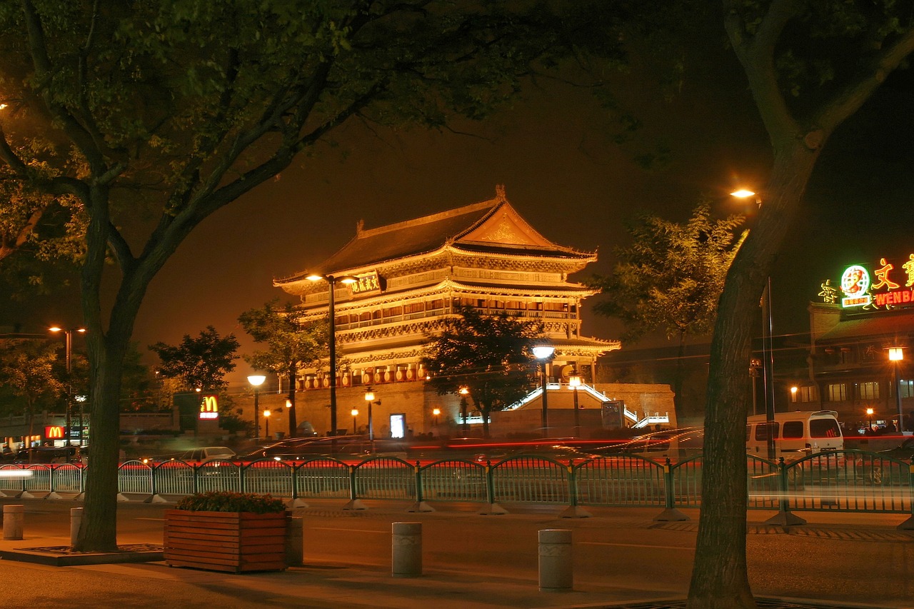 a street scene at night with a building in the background, a picture, inspired by Yang Buzhi, flickr, tiananmen square, high detail photo, very beautiful photo, huge gate