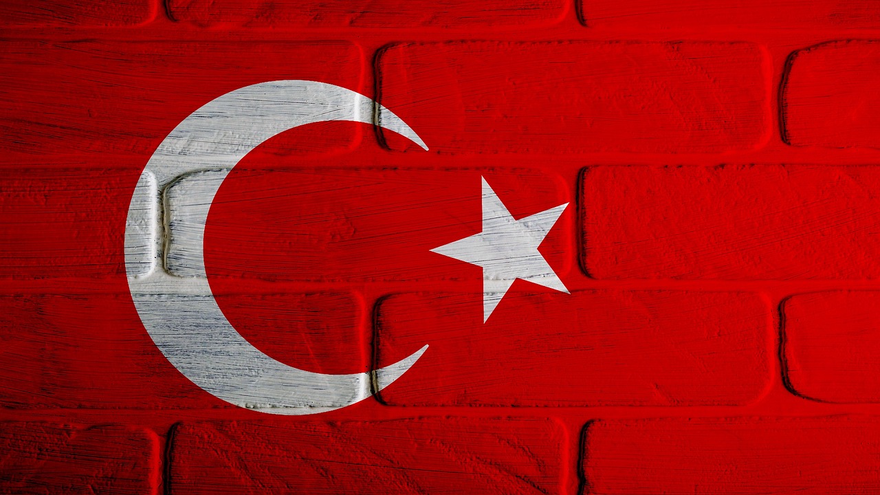 the flag of turkey painted on a brick wall, wooden, hyperrealistic image of x, background image, holiday season