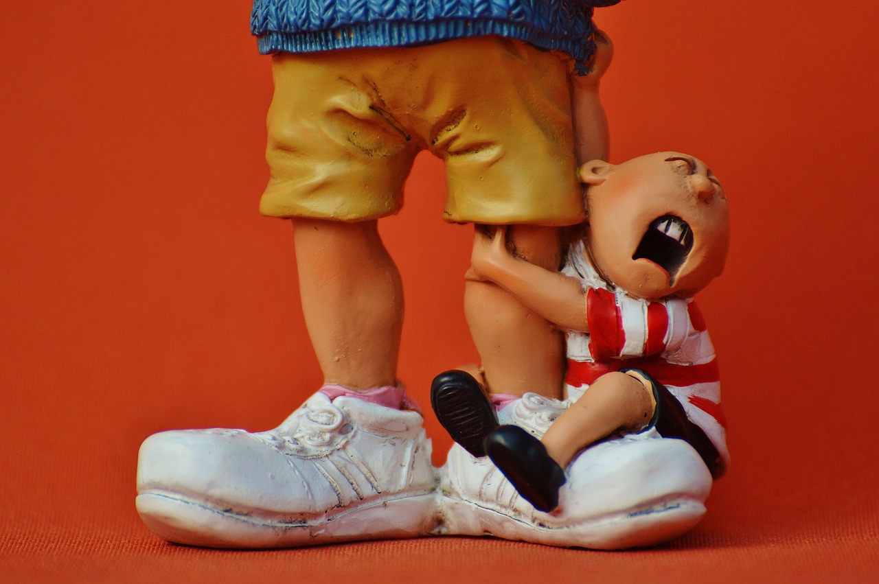 a close up of a figurine of a person on a pair of shoes, a statue, flickr, figurativism, garbage pail kids, screaming and crying, father with child, hergé