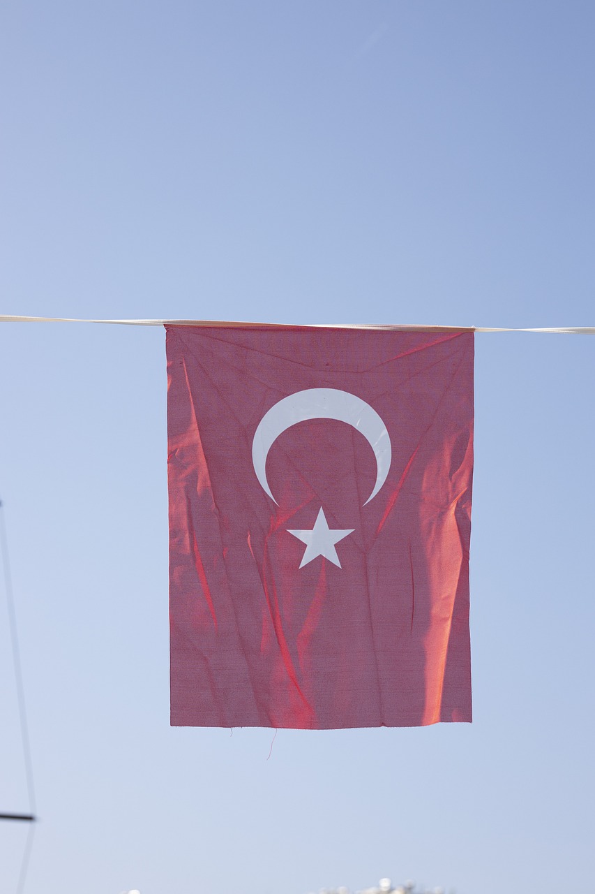 a turkish flag hanging on a clothes line, a photo, by Attila Meszlenyi, hurufiyya, harbor, closeup photo, tourist photo, 2012