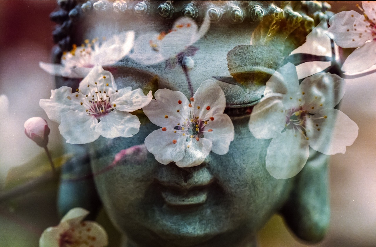 a close up of a statue with flowers on it, a picture, inspired by Kaigetsudō Ando, art photography, with bloom ethereal effects, oriental wallpaper, buddha, almond blossom